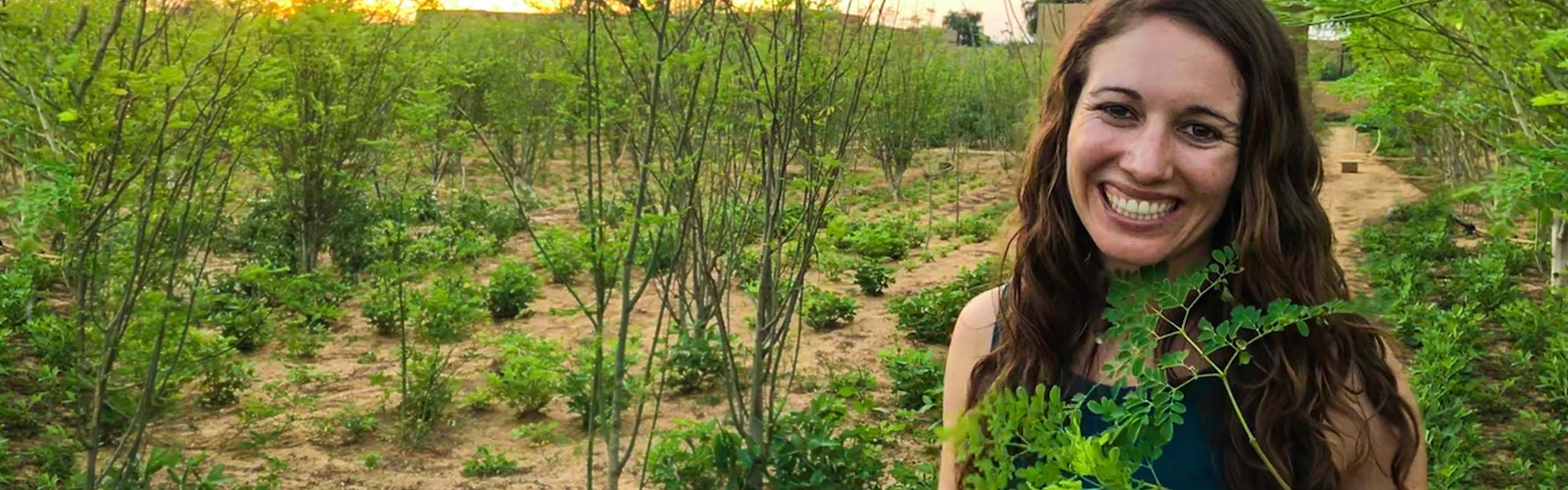 
  
  Lisa Curtis, Kuli Kuli Founder, In a Moringa Field
        