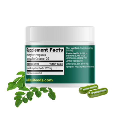 Back of the Kuli Kuli Pure Moringa capsule jar showing the Supplement Facts panel: 1,000 mg organic moringa leaf powder per 2-capsule serving, 30 servings per container. Other ingredients: organic vegetable capsule (pullulan).